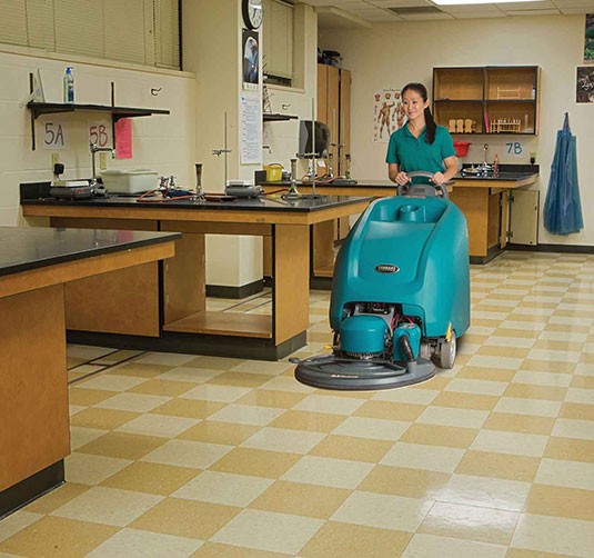 The B5 Battery Burnisher being used in a school classroom.